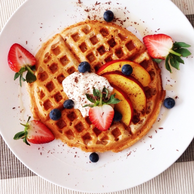 Vanilla waffle with nectarine, strawberries, blueberries, salted caramel and vanilla bean whipped ricotta and yoghurt.